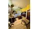 Main bedroom with a queen-size bed and yellow walls at 361 Porpoise Rd, Venice, FL 34293