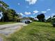 Single-story home with a white garage door and large yard at 361 Porpoise Rd, Venice, FL 34293