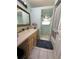 Bathroom with single vanity, shower/tub combo and mirror at 361 Porpoise Rd, Venice, FL 34293