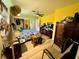 Main bedroom with a queen-size bed and yellow walls at 361 Porpoise Rd, Venice, FL 34293