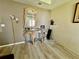 Room with damaged wall and ornate console table at 361 Porpoise Rd, Venice, FL 34293