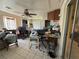 Cluttered sunroom with tile flooring and access to exterior at 361 Porpoise Rd, Venice, FL 34293