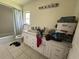Bathroom with double vanity, tub, and white cabinets at 361 Porpoise Rd, Venice, FL 34293