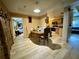 View of dining area and kitchen with light wood cabinets at 361 Porpoise Rd, Venice, FL 34293