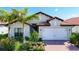 Attractive single-story home with a brick driveway and landscaping at 341 Villoresi Blvd, Nokomis, FL 34275