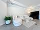 Spacious living room featuring a large sectional sofa and TV at 341 Villoresi Blvd, Nokomis, FL 34275
