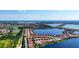 Aerial view of community with lake and numerous houses at 341 Villoresi Blvd, Nokomis, FL 34275
