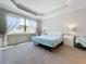 Main bedroom with king-size bed and large window at 341 Villoresi Blvd, Nokomis, FL 34275