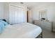 Comfortable bedroom with double doors to closet at 341 Villoresi Blvd, Nokomis, FL 34275