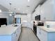 Spacious kitchen with white cabinets, large island, and stainless steel appliances at 341 Villoresi Blvd, Nokomis, FL 34275