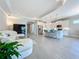 Open floor plan with white kitchen, island, and living room at 341 Villoresi Blvd, Nokomis, FL 34275
