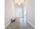 Elegant entryway with tile floors and a bench at 341 Villoresi Blvd, Nokomis, FL 34275