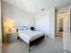 Bedroom with double doors to closet and dresser at 341 Villoresi Blvd, Nokomis, FL 34275
