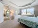 Well-lit bedroom with ensuite bathroom access and a view at 341 Villoresi Blvd, Nokomis, FL 34275
