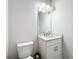 Clean and bright bathroom with white vanity and granite countertop at 341 Villoresi Blvd, Nokomis, FL 34275