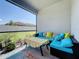 Cozy screened porch with seating and backyard view at 341 Villoresi Blvd, Nokomis, FL 34275