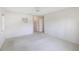 Simple bedroom with ceiling fan and access to a hallway at 8993 Bantry Bay Blvd, Englewood, FL 34224