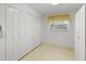 Versatile room with built-in shelving and window at 8993 Bantry Bay Blvd, Englewood, FL 34224