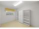 Storage room with shelving and window at 8993 Bantry Bay Blvd, Englewood, FL 34224