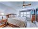Spacious main bedroom with king-size bed and wood furniture at 8911 Midnight Pass Rd # 110, Sarasota, FL 34242