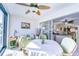 Relaxing sunroom with table and chairs, offering scenic views at 8911 Midnight Pass Rd # 110, Sarasota, FL 34242