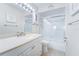 Clean bathroom with a shower/tub combo and updated vanity at 8911 Midnight Pass Rd # 110, Sarasota, FL 34242