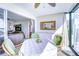 Bright sunroom with table and chairs, offering views of the living area at 8911 Midnight Pass Rd # 110, Sarasota, FL 34242