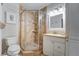 Bathroom with a shower, toilet and vanity at 8911 Midnight Pass Rd # 110, Sarasota, FL 34242
