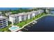 Luxury waterfront condo building with private boat docks and pool at 8911 Midnight Pass Rd # 110, Sarasota, FL 34242