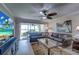 Living room with sectional sofa and water view at 8911 Midnight Pass Rd # 110, Sarasota, FL 34242