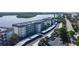 Condo building with covered parking and waterfront access at 8911 Midnight Pass Rd # 110, Sarasota, FL 34242