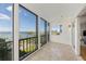 Spacious sunroom with tile flooring and stunning water views at 555 S Gulfstream Ave # 804, Sarasota, FL 34236