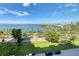 Aerial view showcasing waterfront location and lush landscaping at 555 S Gulfstream Ave # 804, Sarasota, FL 34236