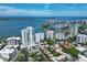 A scenic aerial view of waterfront condos with beautiful bay views, marina, and city skyline in the background at 555 S Gulfstream Ave # 804, Sarasota, FL 34236