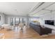 Bright living room with hardwood floors and access to balcony with water view at 555 S Gulfstream Ave # 804, Sarasota, FL 34236