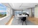 Open dining area with hardwood floors and water views at 555 S Gulfstream Ave # 804, Sarasota, FL 34236