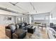 Spacious living room with water view, leather sectional sofa, and hardwood floors at 555 S Gulfstream Ave # 804, Sarasota, FL 34236