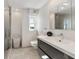 Clean bathroom with walk-in shower and floating vanity at 555 S Gulfstream Ave # 804, Sarasota, FL 34236