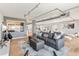 Open living area with gray sectional sofa and view into modern kitchen at 555 S Gulfstream Ave # 804, Sarasota, FL 34236