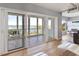 Sunroom with sliding glass doors leading to a balcony overlooking the water at 555 S Gulfstream Ave # 804, Sarasota, FL 34236