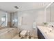 Bathroom with a walk-in shower, toilet and double vanity at 555 S Gulfstream Ave # 804, Sarasota, FL 34236