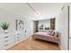 Second bedroom with a pink comforter and white dresser at 555 S Gulfstream Ave # 804, Sarasota, FL 34236