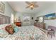 Spacious bedroom with a large bed, dresser and flat screen TV at 7758 Ridgelake Cir, Bradenton, FL 34203