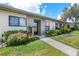 Inviting condo exterior with landscaped grounds and walkway at 6050 28Th W St # 14B, Bradenton, FL 34207