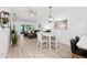 Modern dining area with white table and four chairs at 6050 28Th W St # 14B, Bradenton, FL 34207