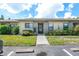 Front view of condo with landscaped walkway at 6050 28Th W St # 14B, Bradenton, FL 34207