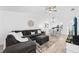 Bright living room featuring L-shaped sofa and dining area at 6050 28Th W St # 14B, Bradenton, FL 34207