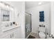 Simple bathroom with white vanity, shower, and tiled floor at 6050 28Th W St # 14B, Bradenton, FL 34207