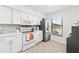 Updated kitchen with white cabinets and stainless steel appliances at 6050 28Th W St # 14B, Bradenton, FL 34207