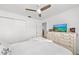 Bright bedroom with a queen bed and large dresser at 6050 28Th W St # 14B, Bradenton, FL 34207